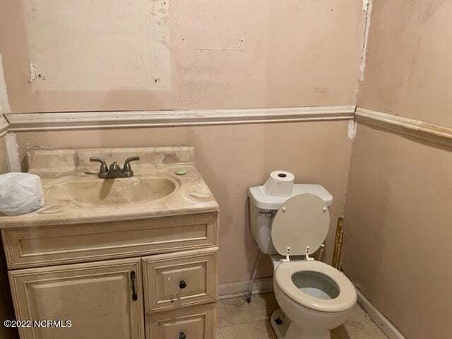 304 E Academy St, Robersonville, NC 27871 - bathroom featuring toilet, tile floors, and vanity