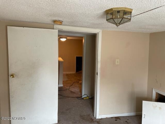 304 E Academy St, Robersonville, NC 27871 - hall with a textured ceiling