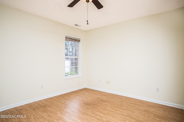 spare room featuring ceiling fan and light hardwood / wood-style floors