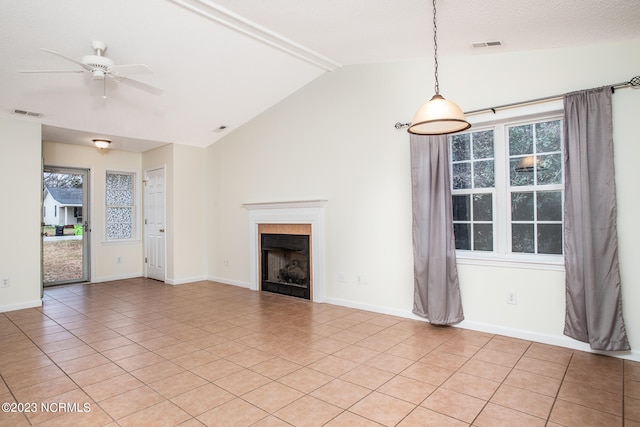 unfurnished living room with ceiling fan, high vaulted ceiling, and light tile flooring