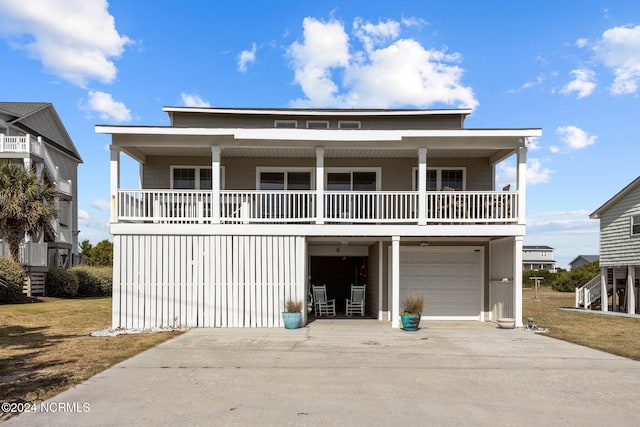 view of front of property with covered porch and a garage