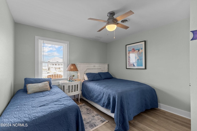 bedroom featuring hardwood / wood-style flooring and ceiling fan