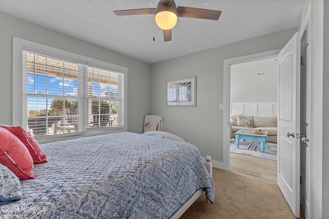 bedroom featuring hardwood / wood-style flooring and ceiling fan