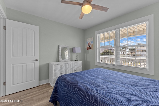 bedroom featuring light hardwood / wood-style floors and ceiling fan