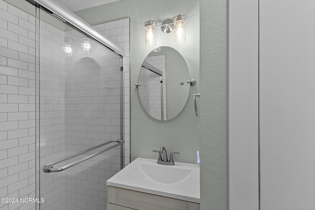 bathroom with vanity and walk in shower