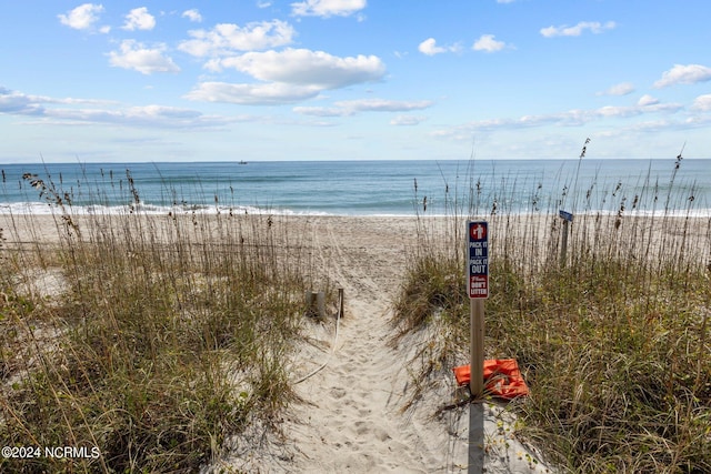 property view of water featuring a beach view