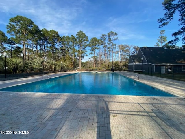 view of pool featuring a patio area