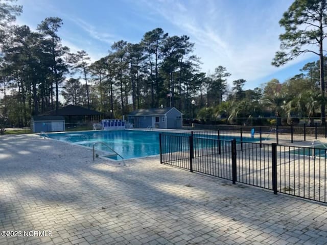 view of pool featuring a patio