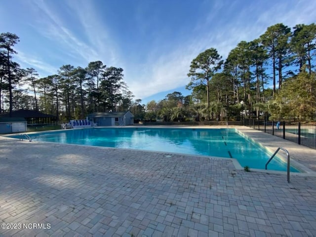 view of pool featuring a patio area