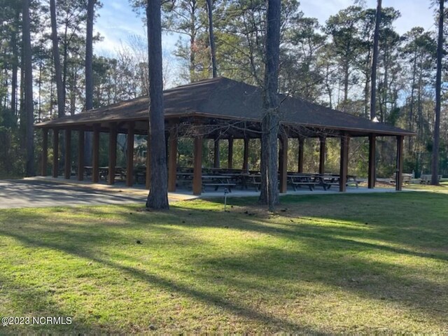 surrounding community with a yard and a gazebo