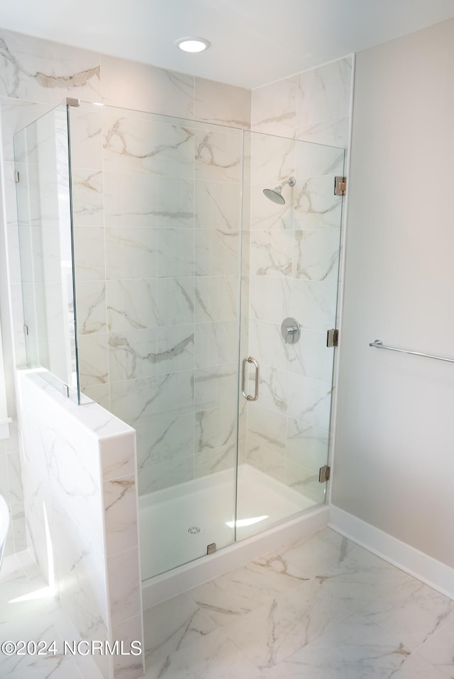 bathroom with an enclosed shower