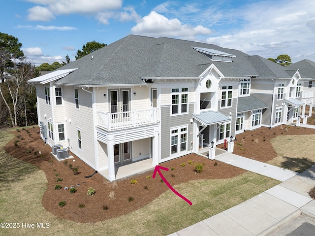 rear view of property with french doors and cooling unit