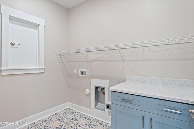 laundry room with cabinets, hookup for a gas dryer, light tile patterned floors, hookup for a washing machine, and electric dryer hookup