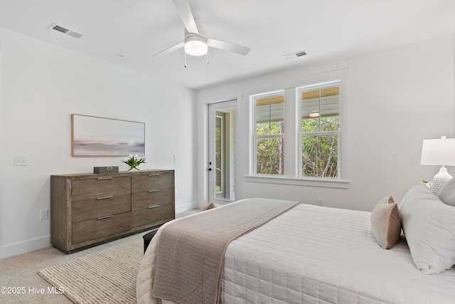 bedroom featuring ceiling fan, access to exterior, and light colored carpet