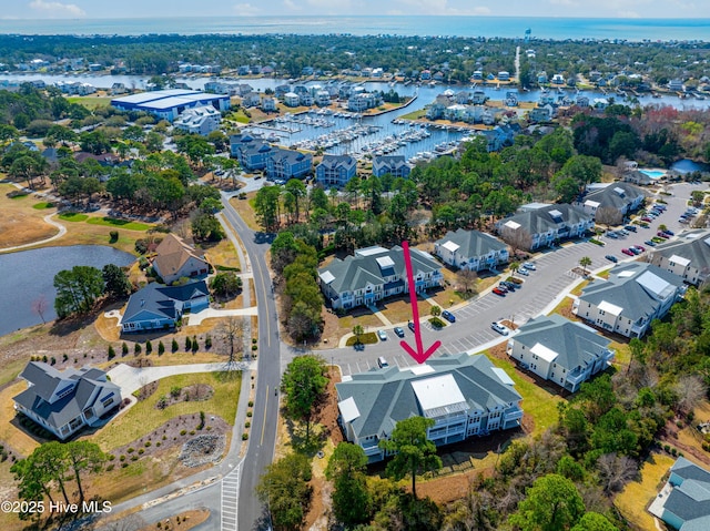 birds eye view of property with a water view