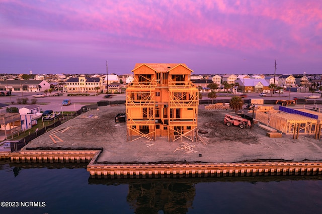 playground at dusk featuring a water view