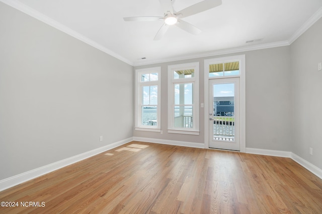 empty room with light hardwood / wood-style floors, ceiling fan, and ornamental molding