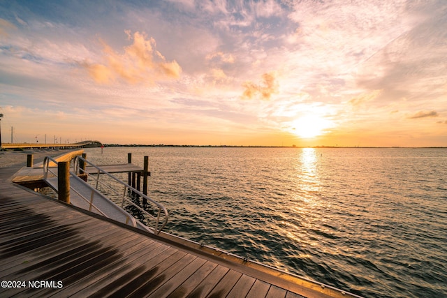 dock area with a water view