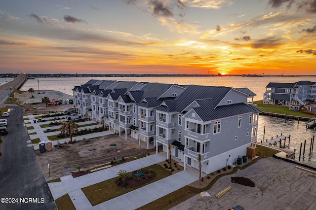 aerial view at dusk with a water view