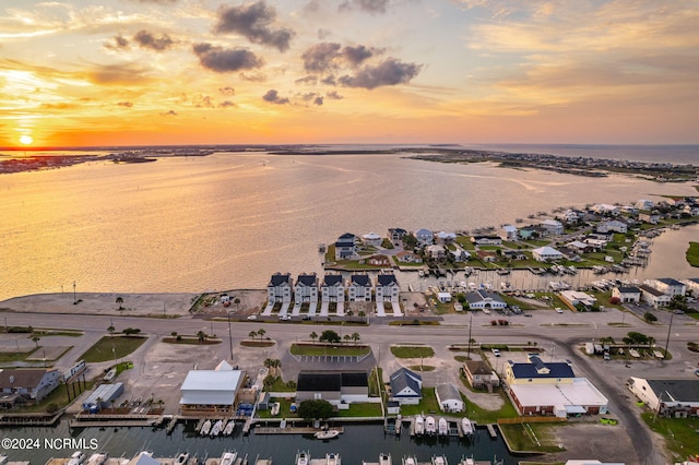 aerial view at dusk with a water view