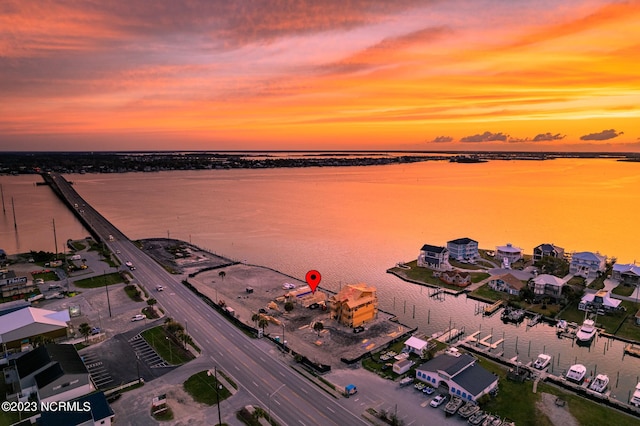 aerial view at dusk with a water view