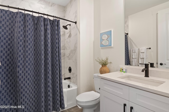 full bathroom featuring shower / tub combo with curtain, vanity, and toilet