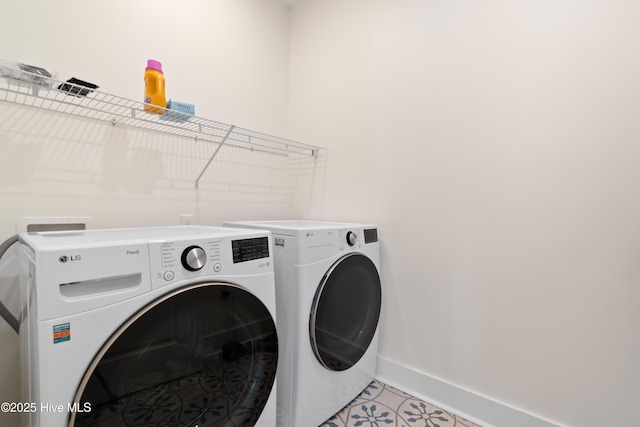 clothes washing area featuring washing machine and dryer