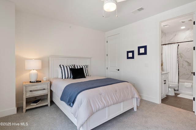 carpeted bedroom with ensuite bath