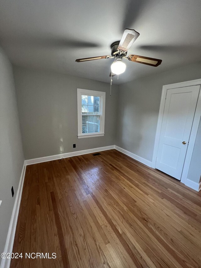 unfurnished bedroom with ceiling fan and light hardwood / wood-style flooring