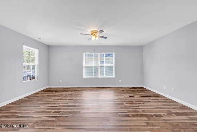 spare room with wood-type flooring and ceiling fan