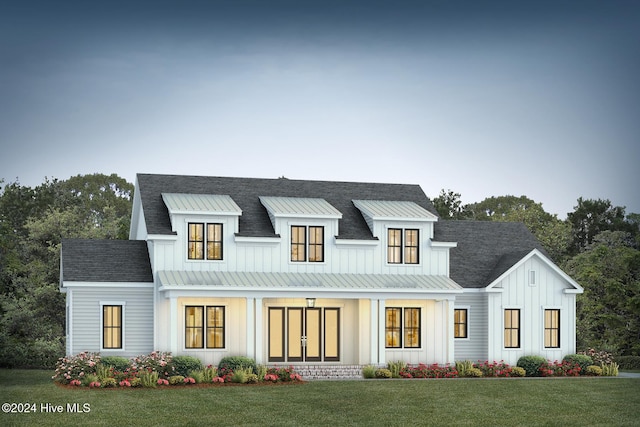 view of front of property featuring a porch and a front yard