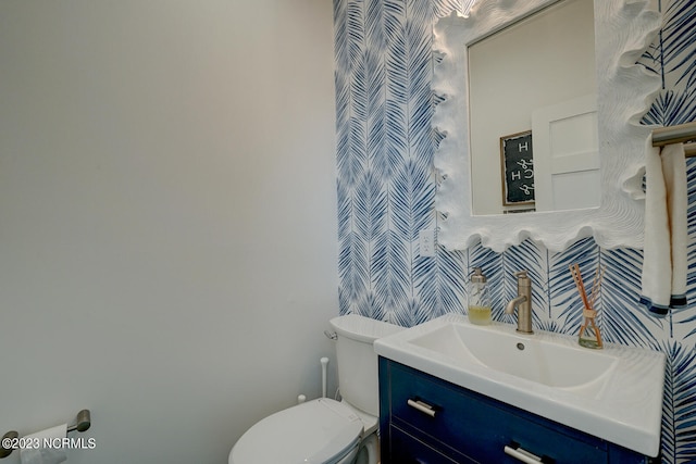 bathroom with oversized vanity and toilet