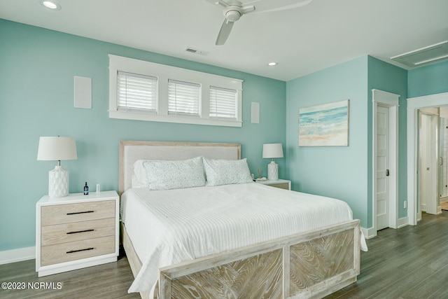 bedroom with ceiling fan and dark hardwood / wood-style floors