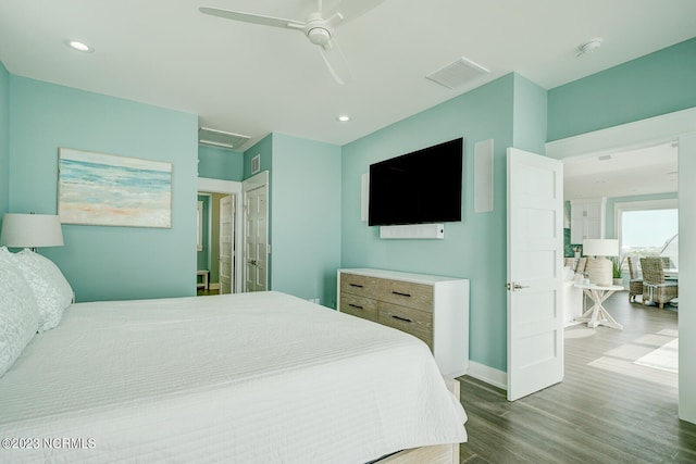 bedroom featuring dark hardwood / wood-style floors and ceiling fan