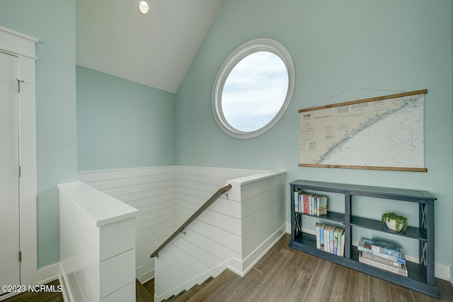 interior space featuring hardwood / wood-style flooring and vaulted ceiling