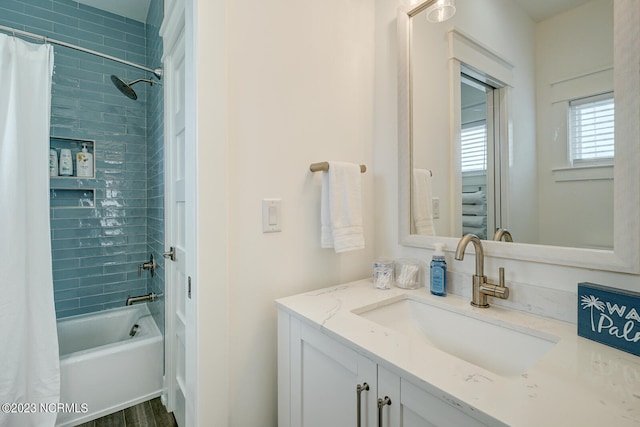 bathroom with shower / bath combo with shower curtain and large vanity