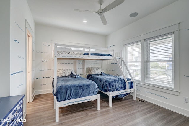 bedroom featuring hardwood / wood-style floors and ceiling fan