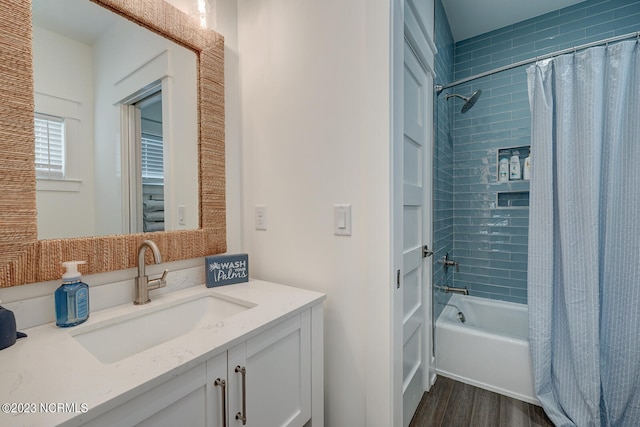 bathroom featuring shower / bathtub combination with curtain, vanity, and wood-type flooring