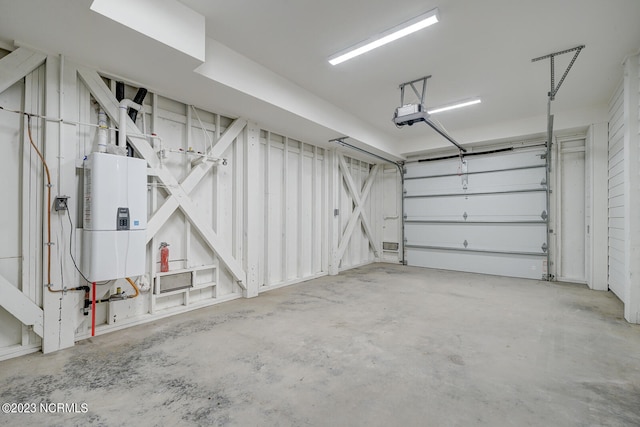 garage with water heater and a garage door opener