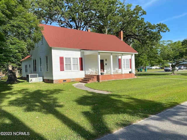 cape cod house with a porch and a front yard