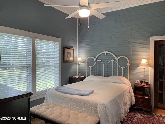 bedroom featuring ceiling fan and dark hardwood / wood-style flooring