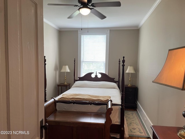 bedroom featuring crown molding, wood-type flooring, and ceiling fan