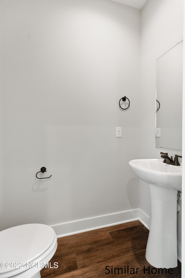 bathroom featuring toilet and hardwood / wood-style floors