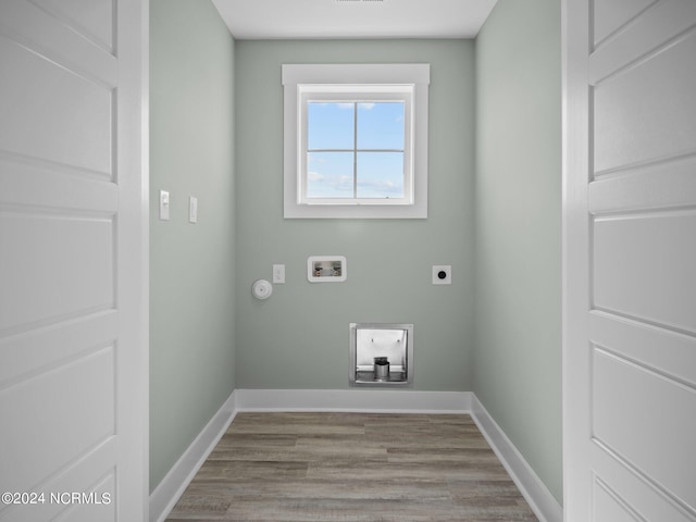 washroom with hookup for a gas dryer, washer hookup, wood-type flooring, and hookup for an electric dryer