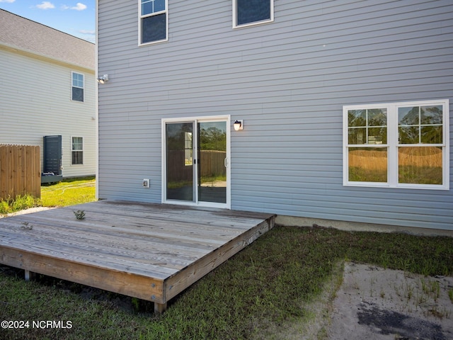 back of property with a wooden deck