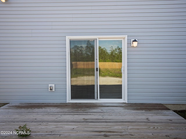 doorway to property with a wooden deck