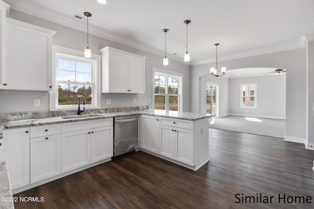 kitchen with a healthy amount of sunlight, dark hardwood / wood-style floors, pendant lighting, and dishwasher