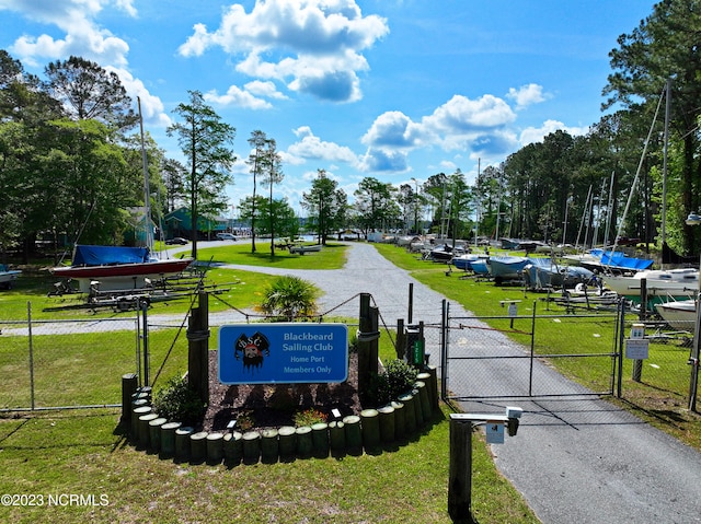 community sign featuring a lawn