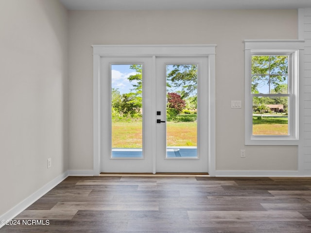 doorway to outside with french doors and wood-type flooring