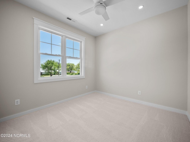 carpeted empty room with ceiling fan